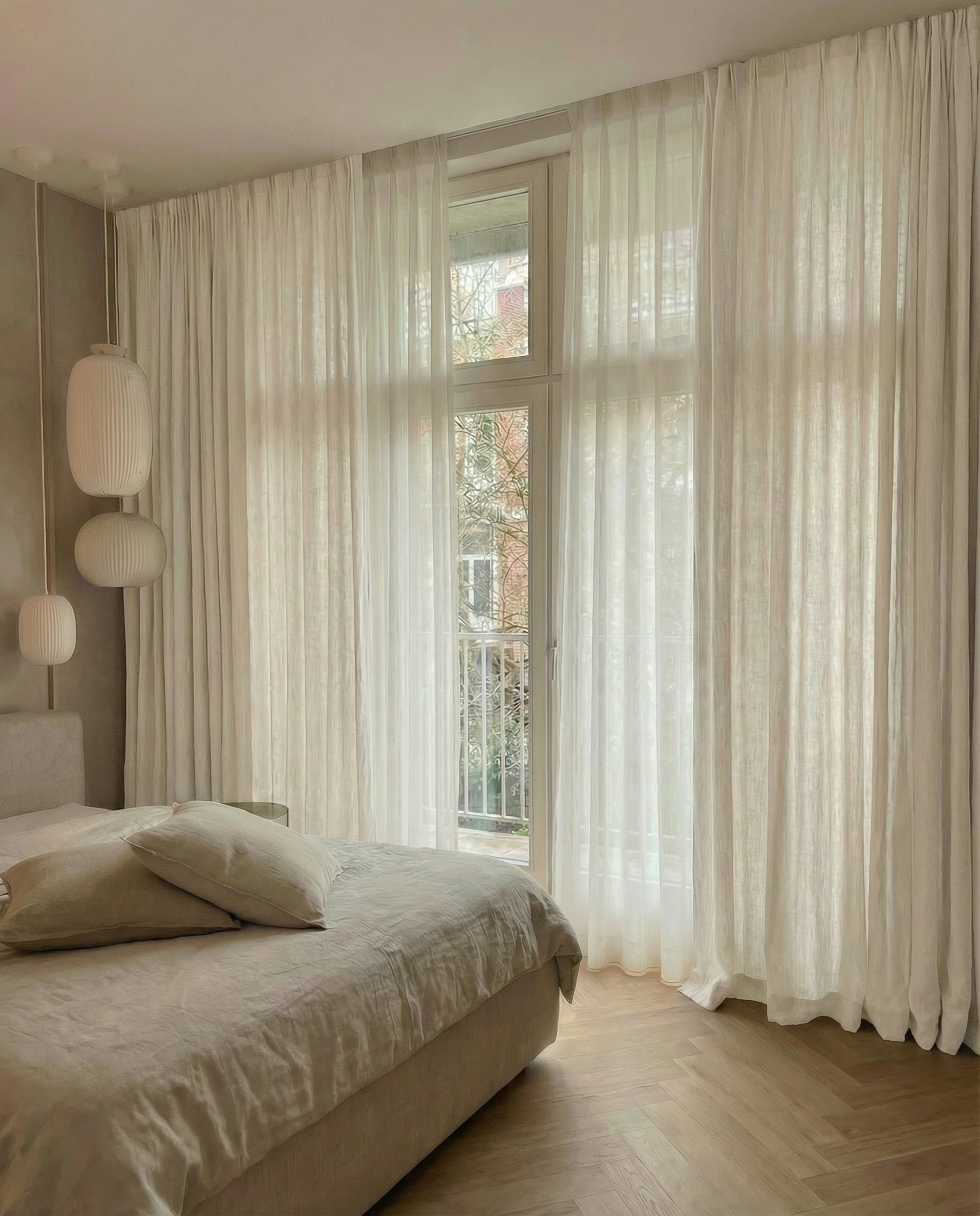 Curtains fully closed across a window showing even fullness and hem