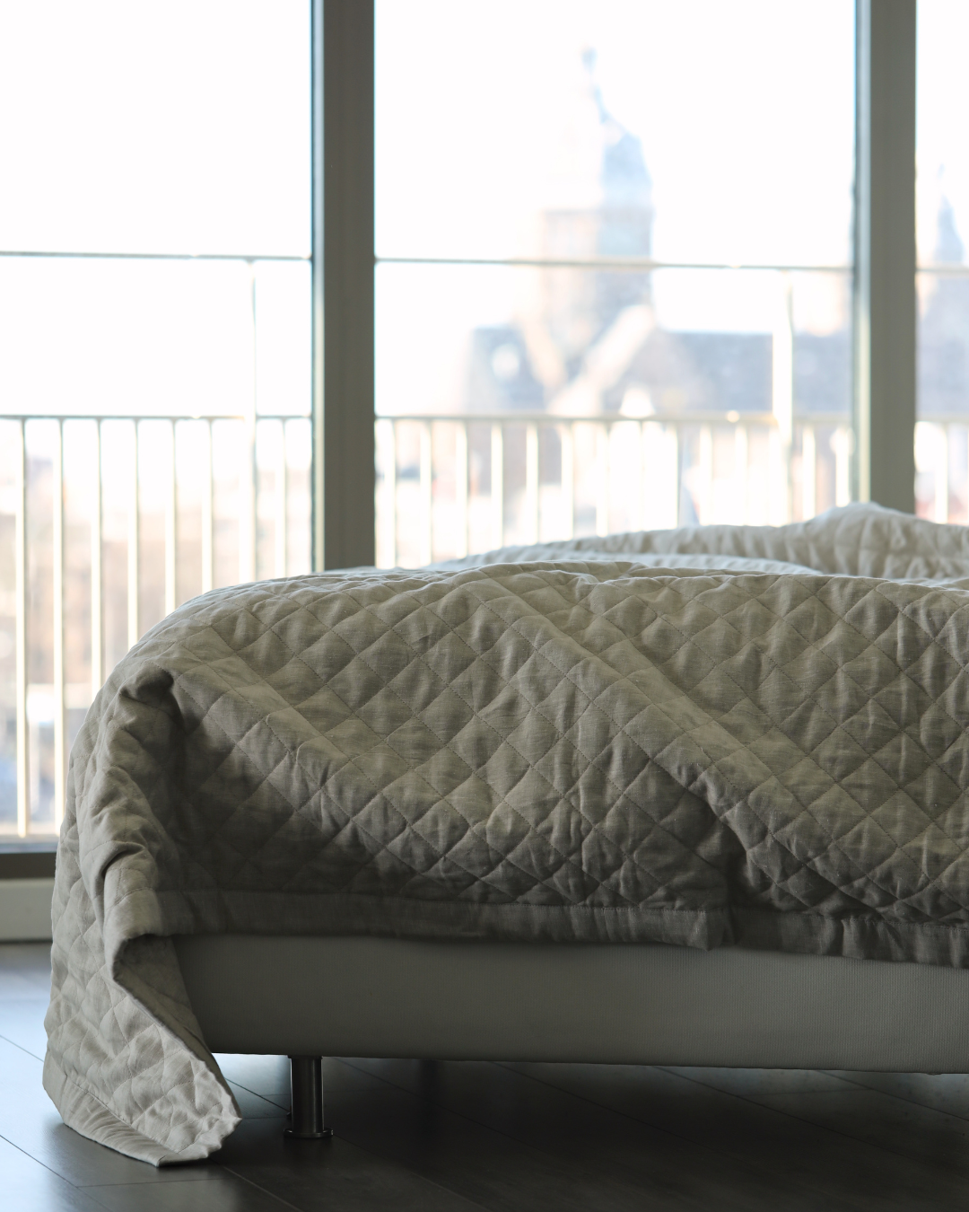 Quilted linen duvet in natural flax colour