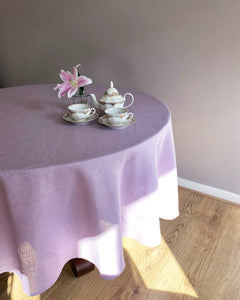 Round tablecloth from soft linen in lilac