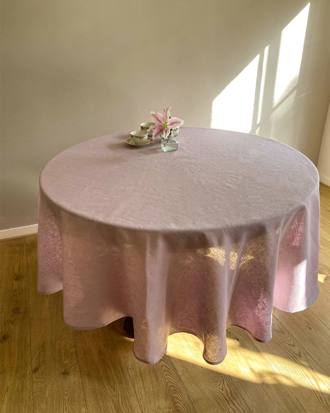 Round tablecloth from soft linen in lilac